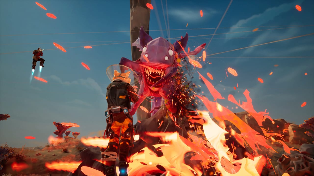 A Gravhound faces a purple alien beast in fire while a packmate boosts on a jetpack